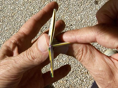 Flexing a hexaflexagon, step 3.