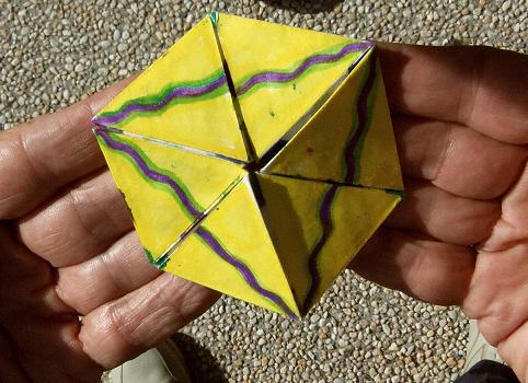 Flexing a hexaflexagon, step 6.